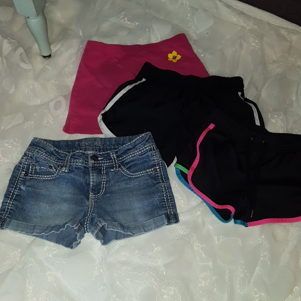 Three pairs of shorts and one skirt shorts.